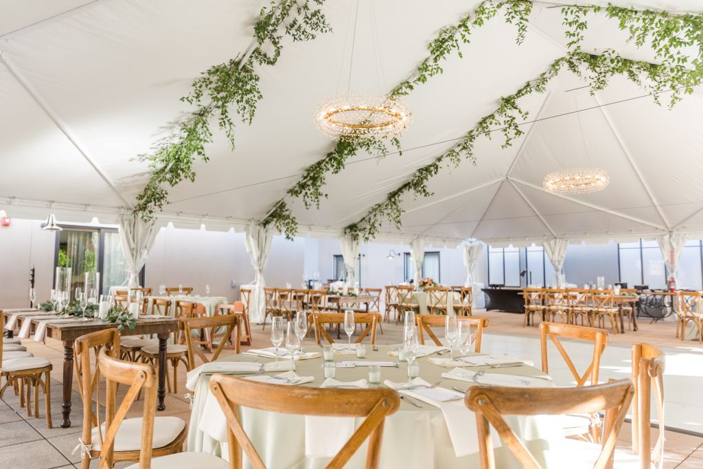 A white tent with tables and chairs
