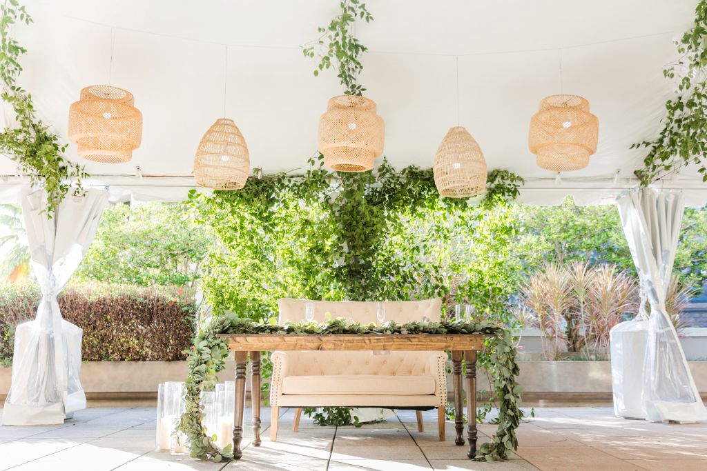 A table and chairs under a white ceiling