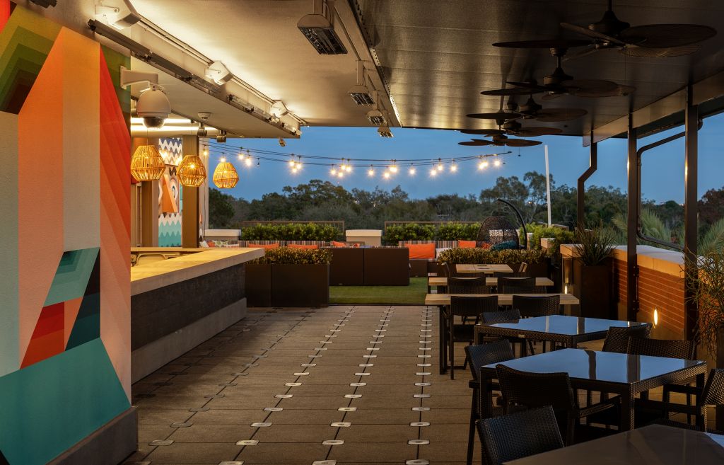 A patio with tables and chairs