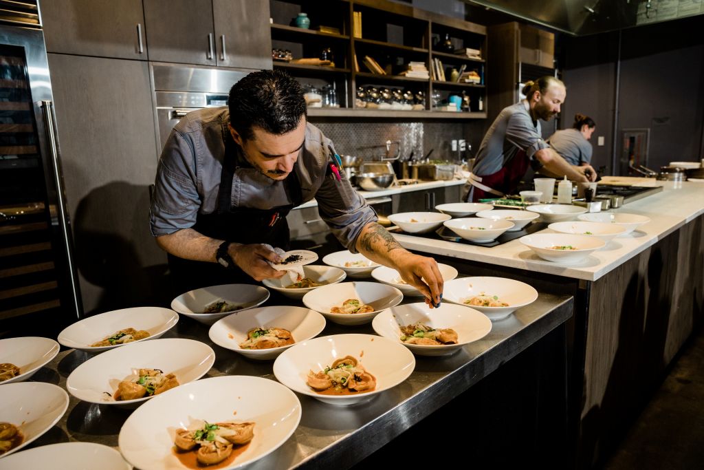 A person in a kitchen preparing food