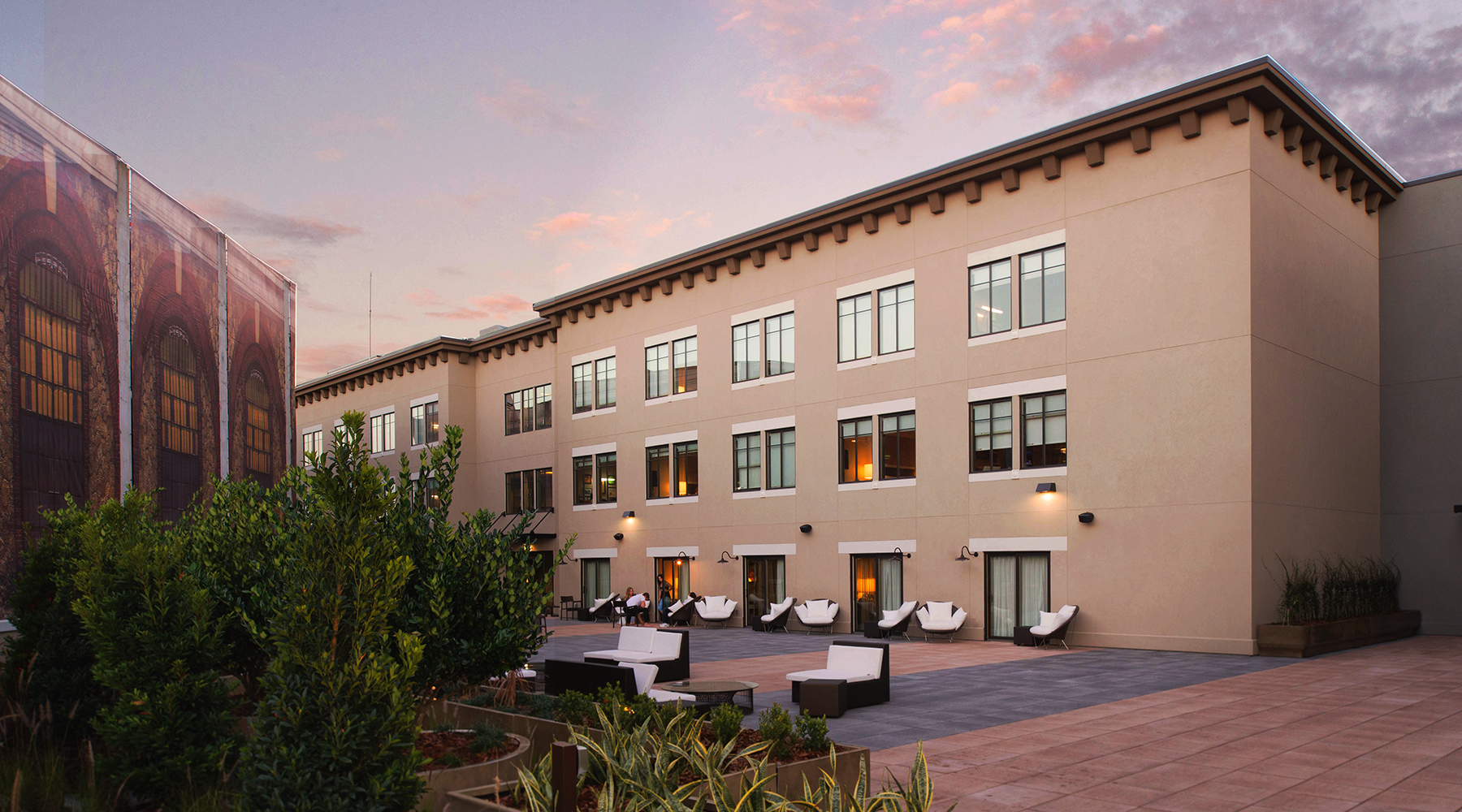 A building with a courtyard and chairs