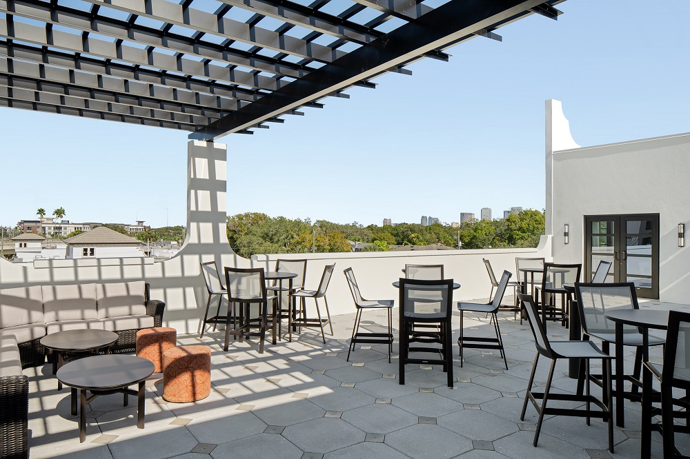 rooftop terrace with hightop table and couch seating area
