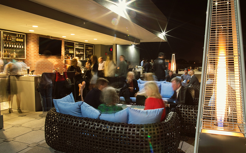 patrons at EDGE rooftop bar