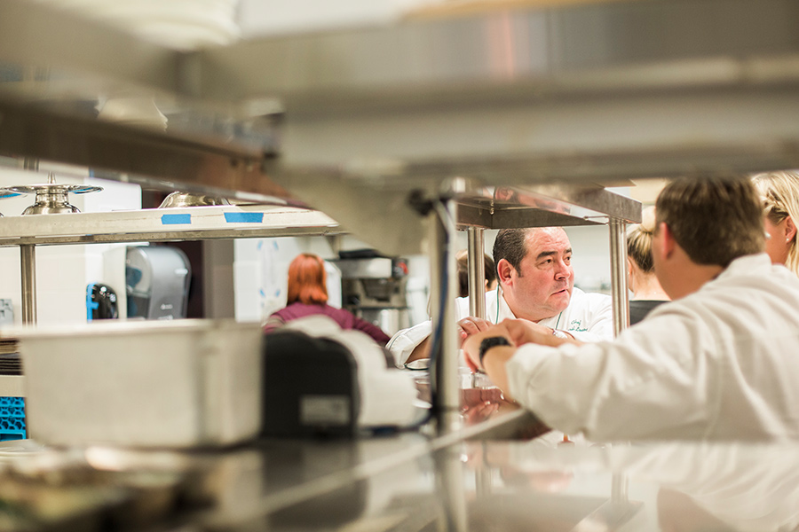 A group of people in a kitchen