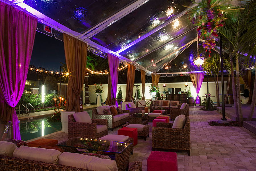 A patio with chairs and a glass roof