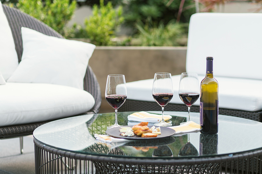 A table with wine glasses and food on it