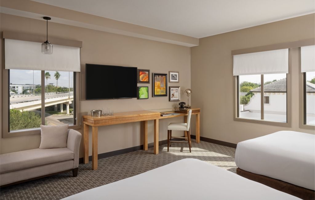 Executive room hotel bedroom in boutique Epicurean Hotel in South Tampa