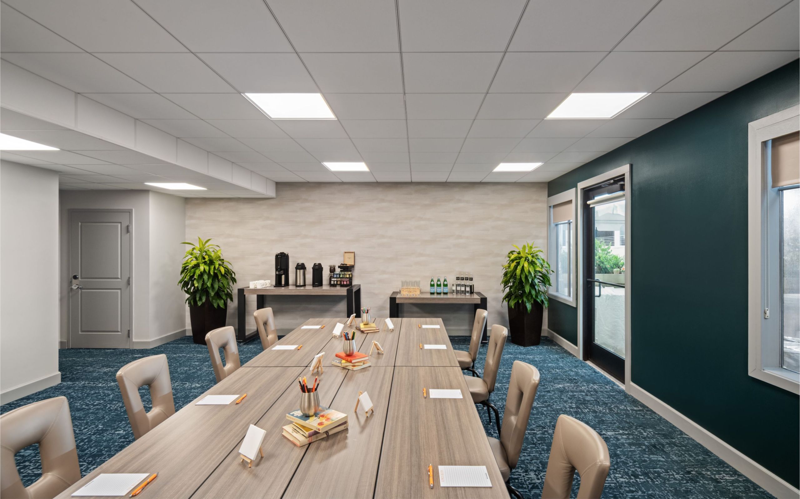 a meeting room with a long conference table