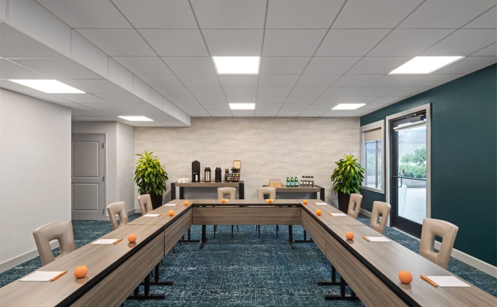 a meeting room with u-shape seating